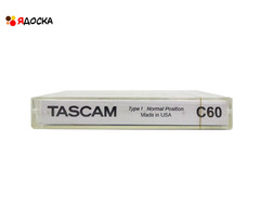 Аудиокассета "TASCAM" с катушками серебристого цвета