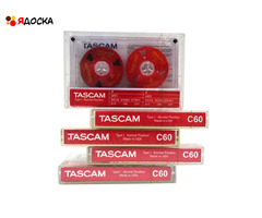 Аудиокассета "TASCAM" с катушками красного цвета с жёлтым текстом