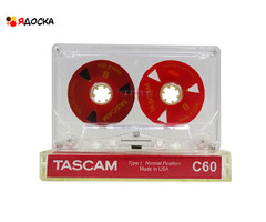 Аудиокассета "TASCAM" с катушками красного цвета с жёлтым текстом