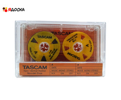 Аудиокассета "TASCAM" с катушками оранжевого цвета